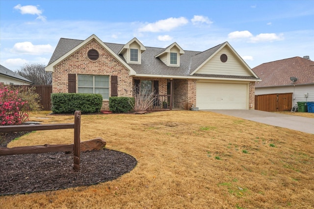 view of front of house with a garage and a front yard