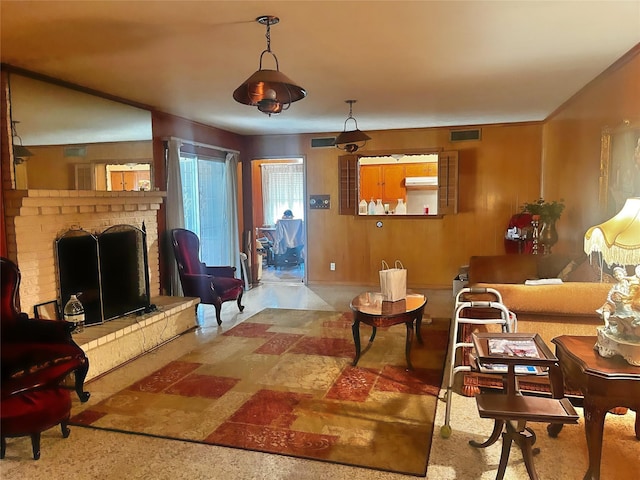 living room featuring a brick fireplace