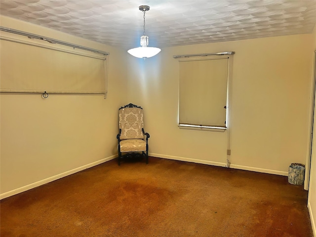 carpeted spare room featuring a textured ceiling