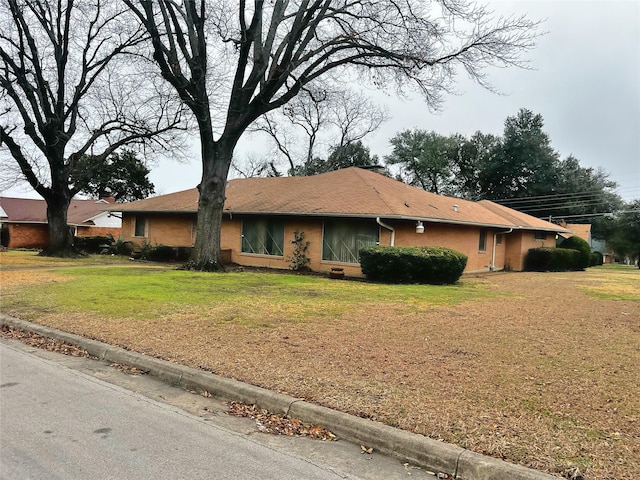 ranch-style house with a front yard