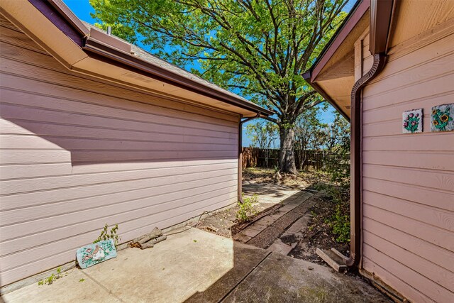 view of side of property featuring a patio