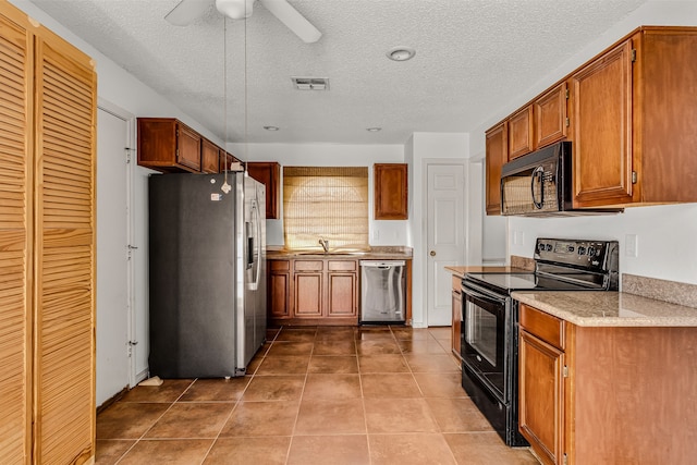 kitchen featuring sink, a textured ceiling, light tile patterned floors, ceiling fan, and black appliances