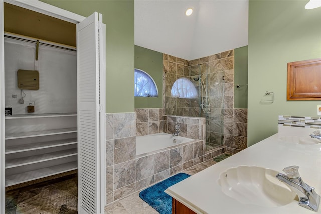 bathroom with vanity and separate shower and tub