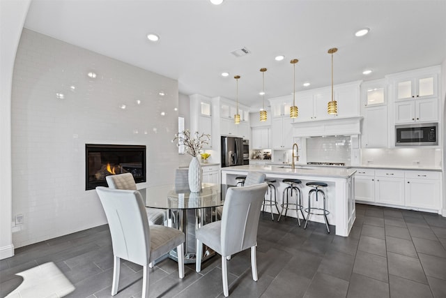 dining room featuring sink