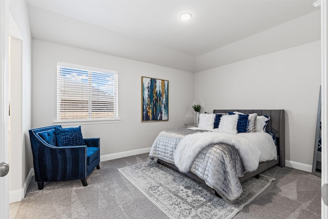 bedroom with carpet and lofted ceiling