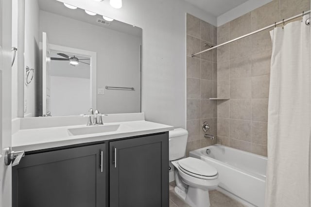 full bathroom with vanity, shower / tub combo, ceiling fan, and toilet