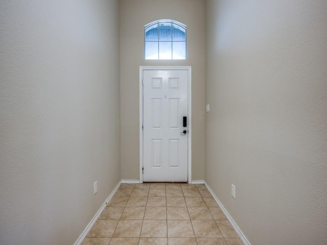 entryway featuring light tile patterned floors