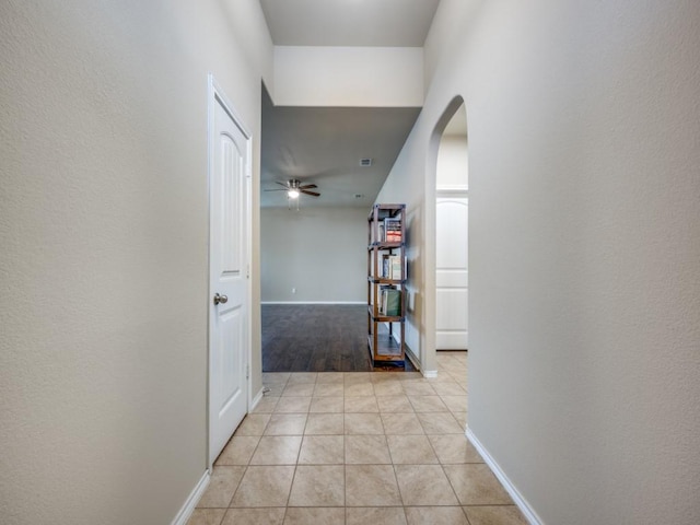 hallway with light tile patterned floors