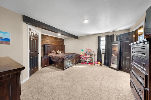 carpeted bedroom with wood walls