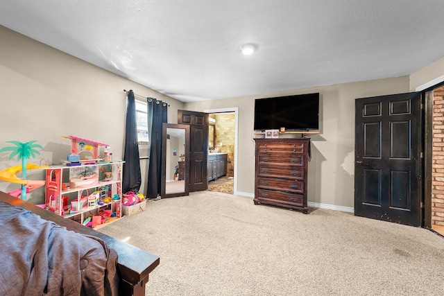 playroom with light carpet and a textured ceiling