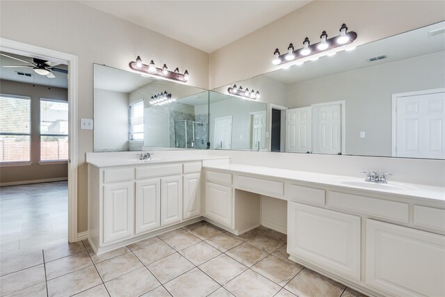 bathroom featuring ceiling fan, tile patterned floors, vanity, and an enclosed shower