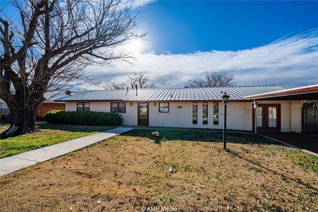 ranch-style home with a front yard