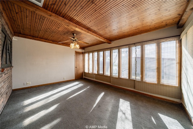 unfurnished sunroom with ceiling fan, wooden ceiling, and beam ceiling