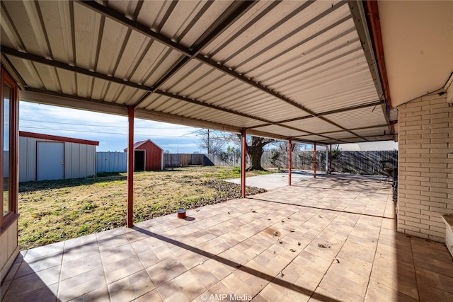 view of patio featuring a shed