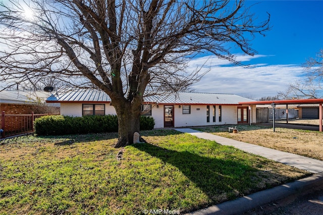 ranch-style house with a carport and a front lawn