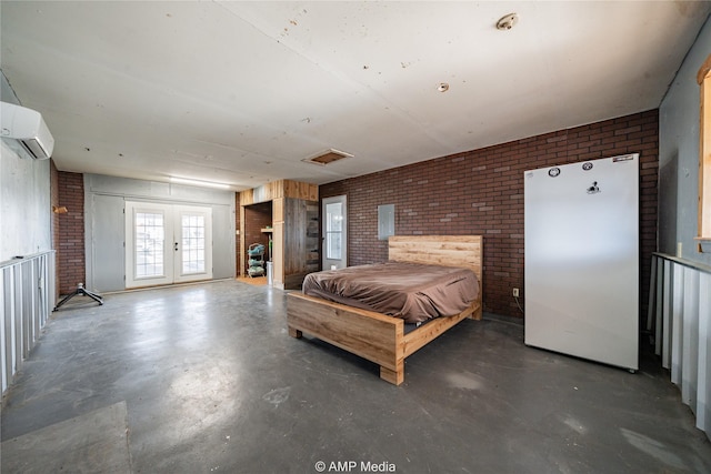 bedroom with french doors, brick wall, and an AC wall unit