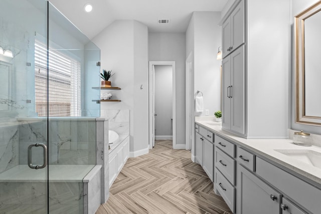 bathroom with parquet floors, vanity, independent shower and bath, and vaulted ceiling