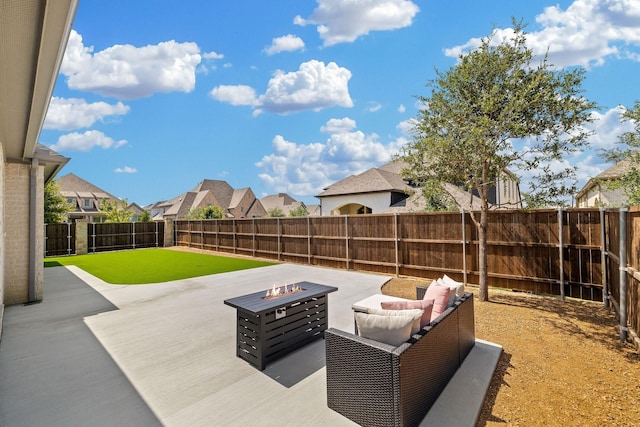 view of patio with a fire pit