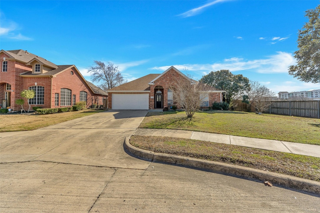 view of front facade featuring a garage and a front yard