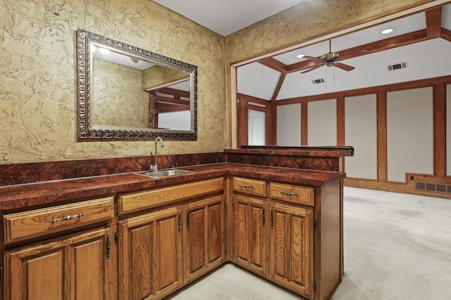 bathroom with vanity, vaulted ceiling, and ceiling fan