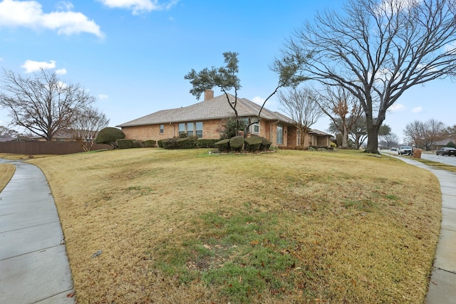 view of side of property featuring a lawn