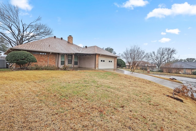 single story home featuring a garage and a front lawn