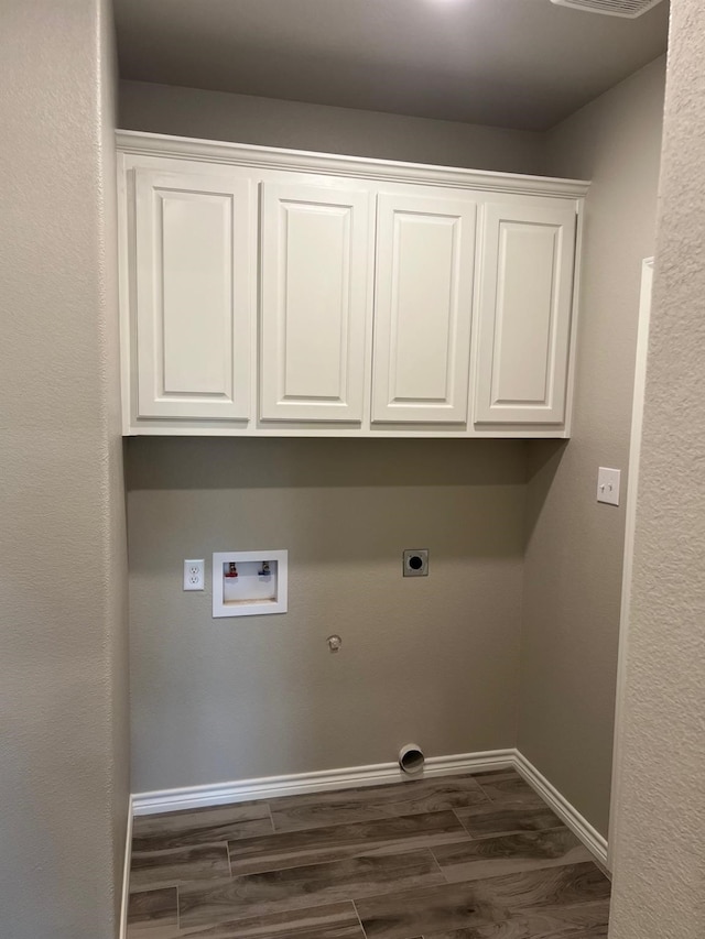 laundry area with cabinets, washer hookup, hookup for a gas dryer, and electric dryer hookup