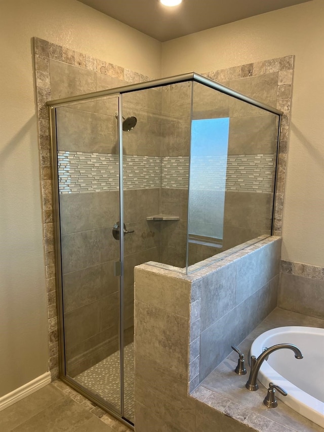 bathroom featuring separate shower and tub and tile patterned floors