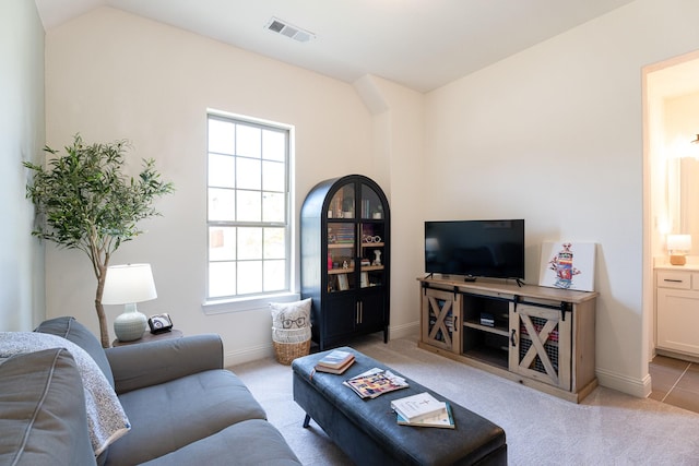 living room with light colored carpet and lofted ceiling