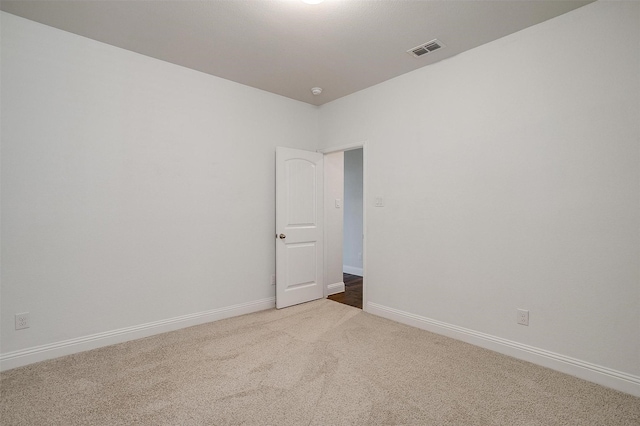 empty room featuring carpet flooring