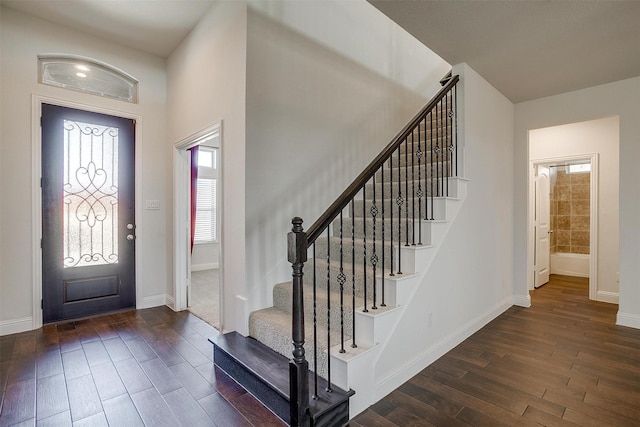 foyer entrance with dark wood-type flooring