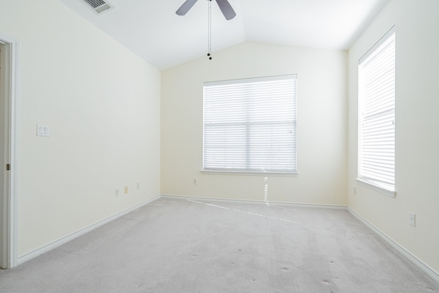 carpeted empty room with lofted ceiling and ceiling fan