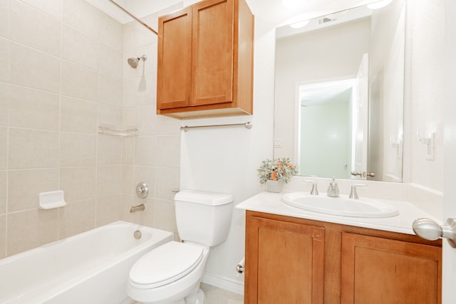 full bathroom with vanity, tiled shower / bath combo, and toilet