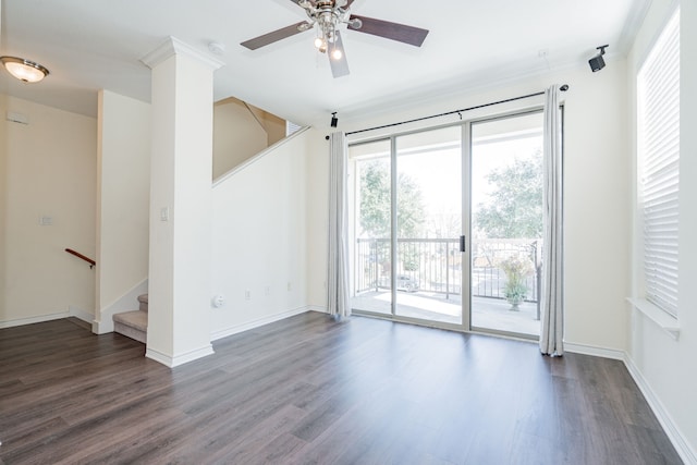 empty room with dark hardwood / wood-style floors and ceiling fan