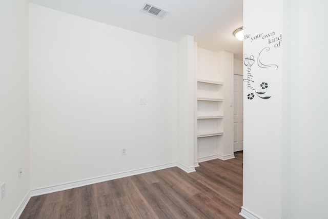 hallway featuring dark hardwood / wood-style flooring