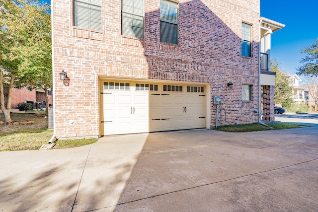 view of property exterior with a garage