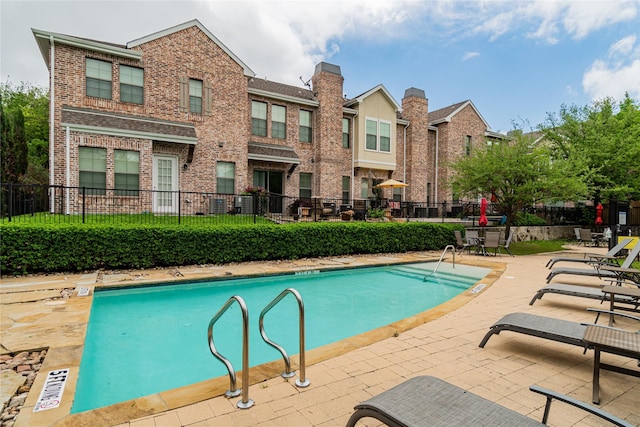 view of swimming pool featuring a patio area