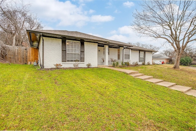 ranch-style house with a front lawn