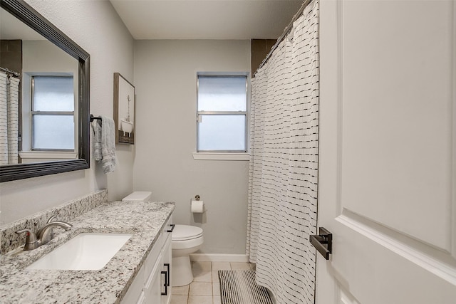 bathroom with tile patterned flooring, vanity, toilet, and a shower with shower curtain