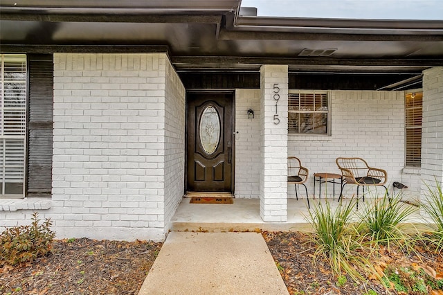 entrance to property with covered porch