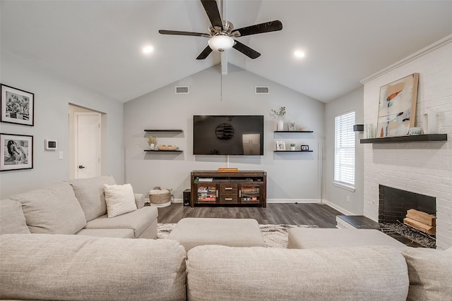 living room featuring ceiling fan, a fireplace, dark hardwood / wood-style flooring, and lofted ceiling with beams