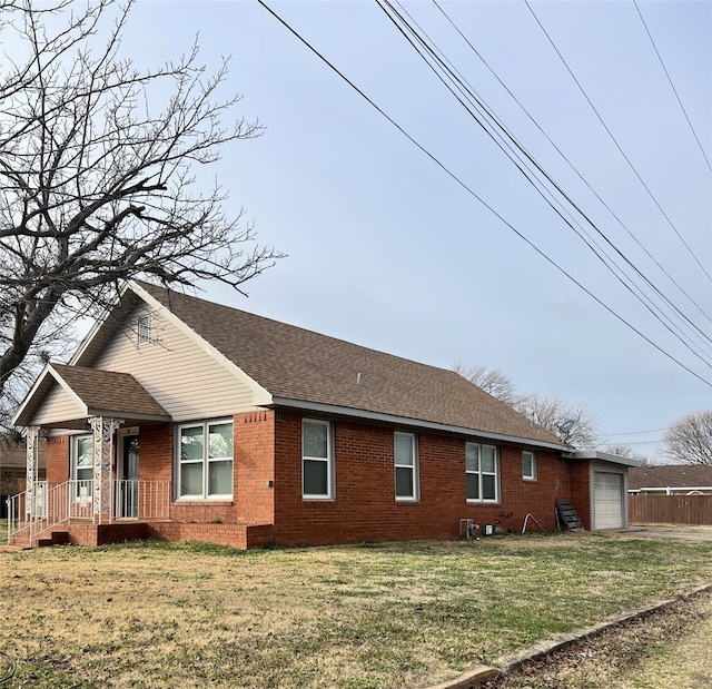 view of property exterior with a garage and a yard