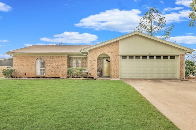 ranch-style home with a garage and a front yard