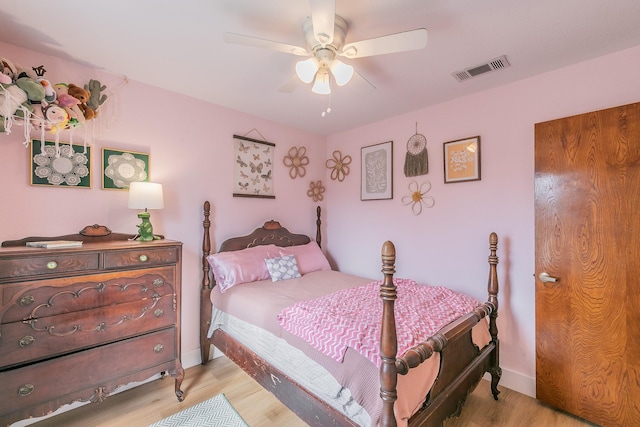 bedroom featuring ceiling fan and light hardwood / wood-style flooring