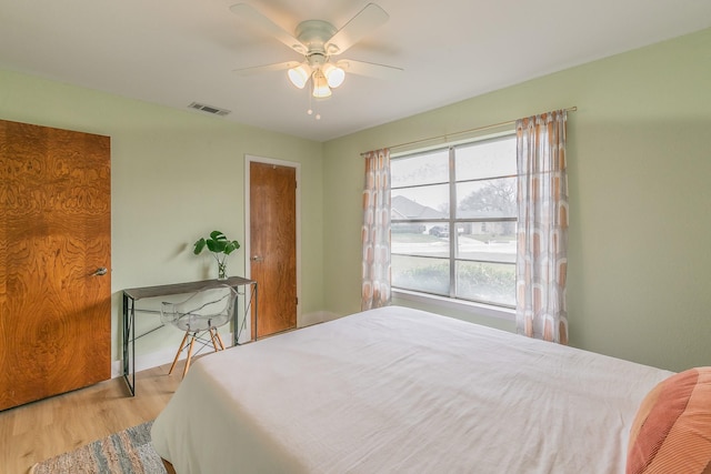 bedroom featuring ceiling fan and light wood-type flooring