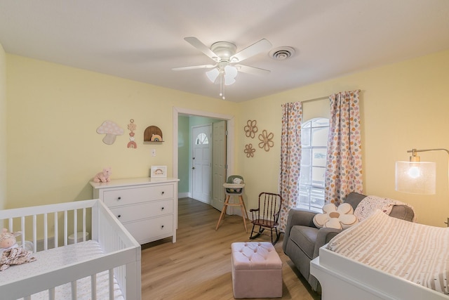 bedroom featuring light hardwood / wood-style flooring and ceiling fan