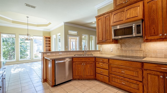 kitchen featuring sink, decorative light fixtures, light tile patterned flooring, and appliances with stainless steel finishes