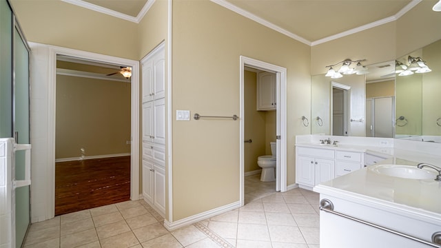 bathroom with ceiling fan, tile patterned flooring, ornamental molding, toilet, and walk in shower