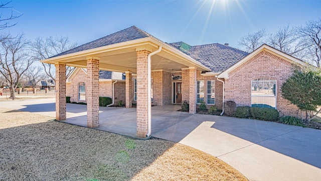 view of front facade with a carport