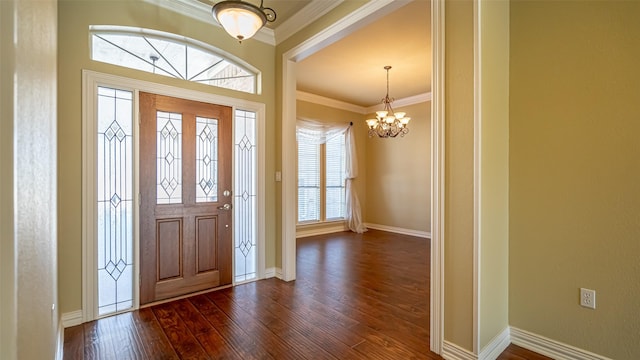 foyer with crown molding, a notable chandelier, and dark hardwood / wood-style flooring